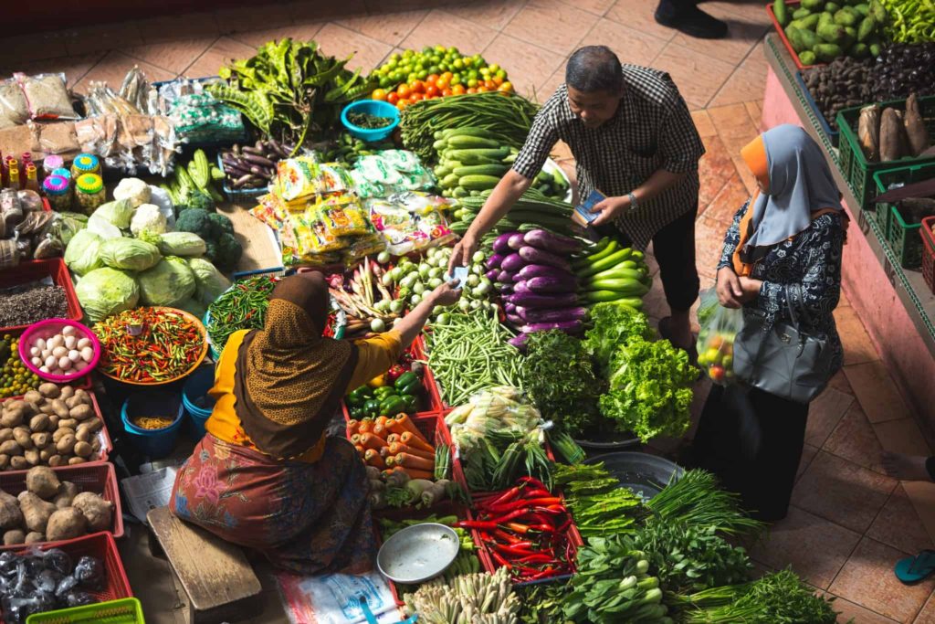 People Shopping for Fresh Produce in a Local Market