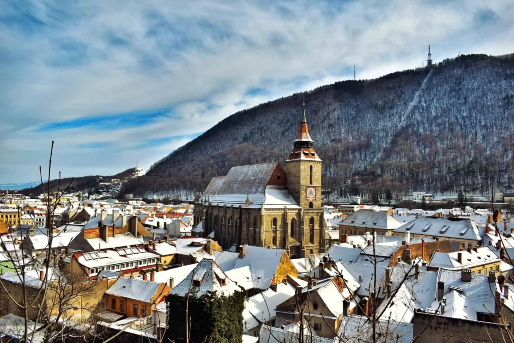 The Medieval Charm of Brasov in Winter Set Against the Carpathian Backdrop