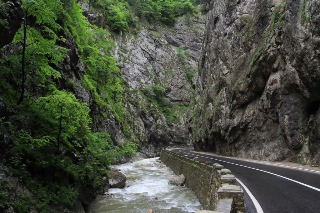 View of the Towering Rock Walls of Bicaz Gorge and the Winding Road Through the Natural Wonder