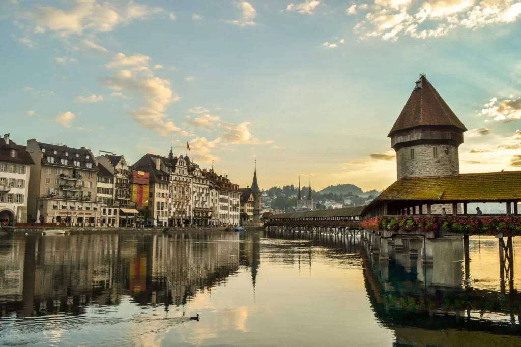 In Lucerne, the Chapel Bridge, With Its Iconic Wooden Structure and Stunning Views of the Reuss River, Is a Symbol of the City’s Rich History.